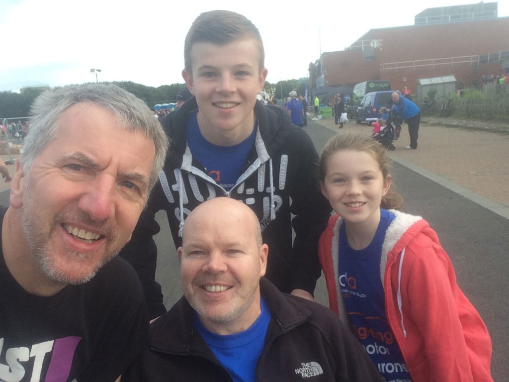 Joining superstar Anto Finnegan and his family before the Belfast half-marathon. Team Anto, raising funds for MND research, were prominent among the 3,500 participants. 